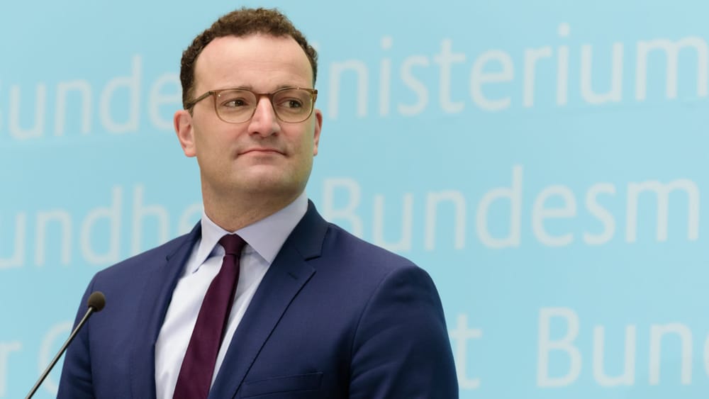 Spahn hinter Gitter Beitragsbild